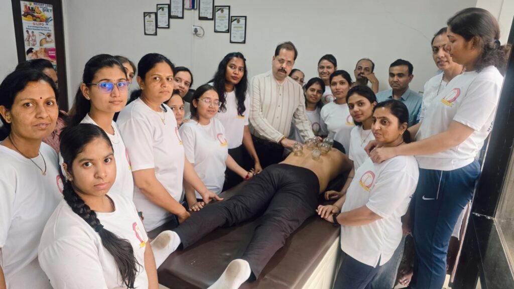 Dr. Nitin Shipi conducting physiotherapy practical session with diploma students in OPD at Ashirwad Yog-Naturopathy College