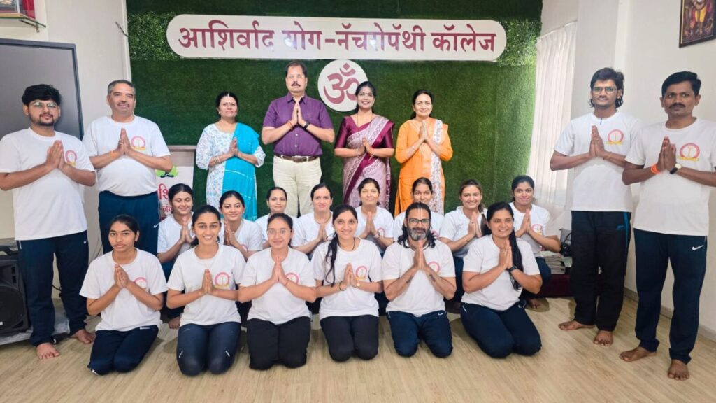 Group photo of Ashirwad Yog Naturopathy College students and teachers celebrating International Yoga Day 2025 with the theme One Earth One Health.
